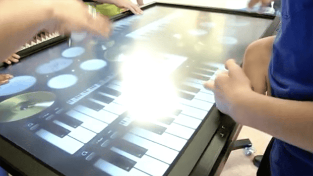 Hands on touch screen.png