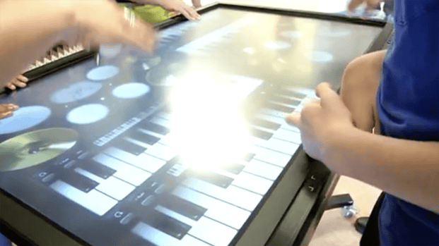 Hands on touch screen.png