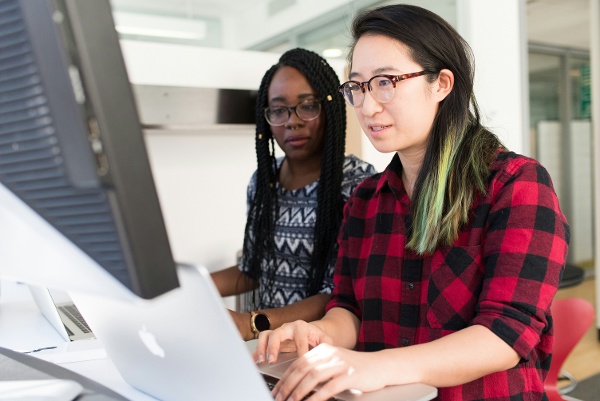 Teachers working on computer