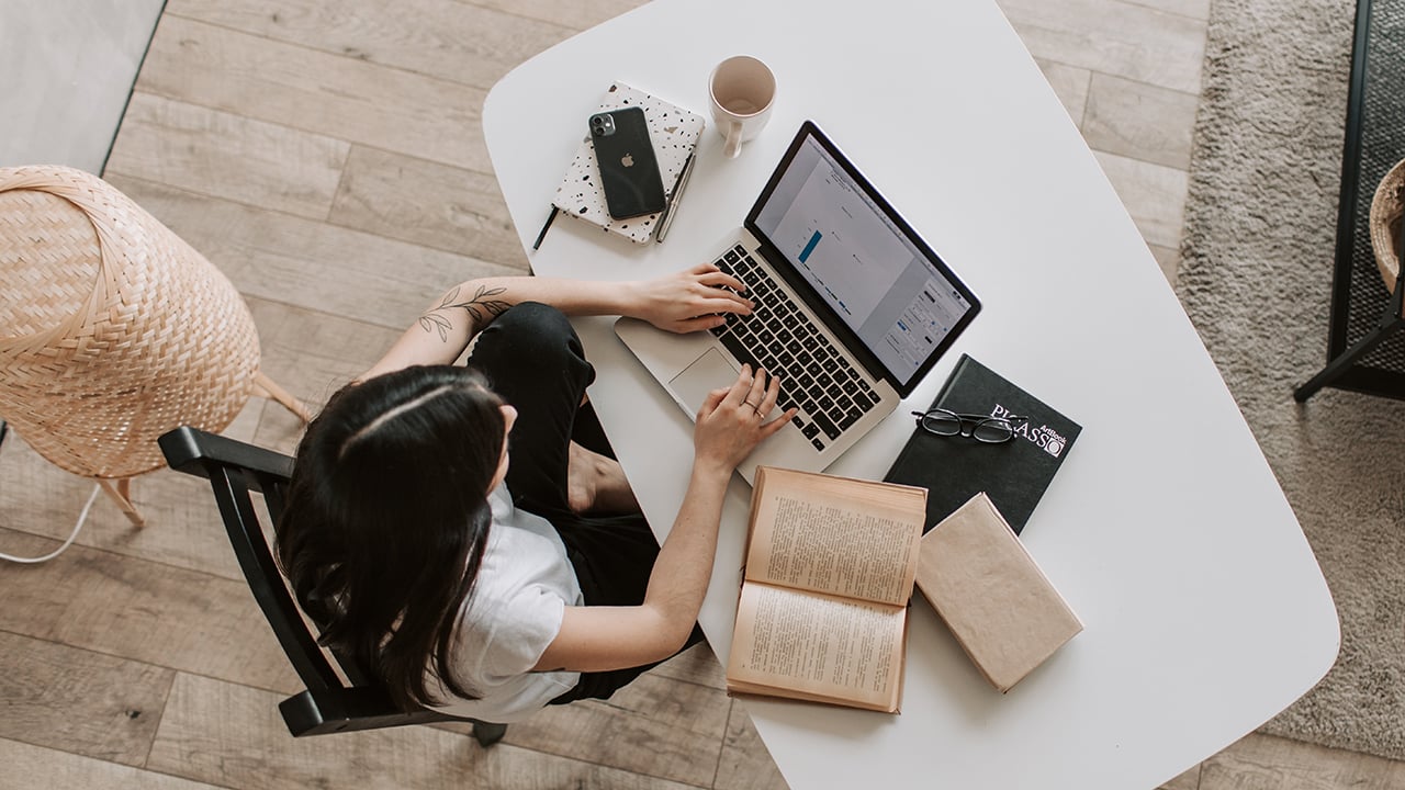 girl typing on laptop