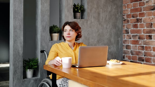 photo-of-woman-sitting-by-the-table-while-looking-away-4064638